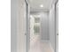 Bright hallway with access to bathroom and closets at 8125 Sw 81St Loop, Ocala, FL 34476