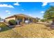 House exterior showcasing backyard and rock landscaping at 8125 Sw 81St Loop, Ocala, FL 34476