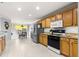 Open concept kitchen with island and stainless steel appliances at 8125 Sw 81St Loop, Ocala, FL 34476