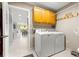 Laundry room with washer, dryer, and storage cabinets at 8125 Sw 81St Loop, Ocala, FL 34476