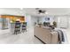 Living room features neutral decor, comfy seating, and kitchen view at 8125 Sw 81St Loop, Ocala, FL 34476