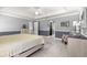 Main bedroom with king-size bed and access to walk-in closet at 8125 Sw 81St Loop, Ocala, FL 34476