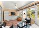 Bright sunroom with built-in cabinets and outdoor access at 8125 Sw 81St Loop, Ocala, FL 34476
