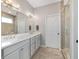 Double vanity bathroom with a large walk-in shower at 822 Nw 45Th Pl, Ocala, FL 34475