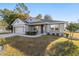 One story home with gray siding, stone accents, and a two-car garage at 822 Nw 45Th Pl, Ocala, FL 34475