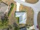Aerial view of roofline, driveway, and landscaping, highlighting the property's position within the community at 8574 Sw 60Th Ct, Ocala, FL 34476
