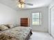 Cozy bedroom with natural light, a ceiling fan, and closet space at 8574 Sw 60Th Ct, Ocala, FL 34476