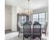 Elegant dining room featuring a chandelier, window, and classic furnishings at 8574 Sw 60Th Ct, Ocala, FL 34476