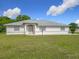 Charming single-story home with a well-maintained lawn and neutral color palette at 8574 Sw 60Th Ct, Ocala, FL 34476