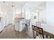 Kitchen with wood-look floors, white cabinets, and a breakfast bar at 8574 Sw 60Th Ct, Ocala, FL 34476