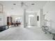 Spacious open-concept living room and dining area with elegant chandelier and neutral color palette at 8574 Sw 60Th Ct, Ocala, FL 34476