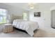 Bright bedroom with ceiling fan, two windows, and neutral decor at 8574 Sw 60Th Ct, Ocala, FL 34476