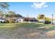 Spacious backyard with a screened-in patio, surrounded by mature trees and lush landscaping at 8648 Sw 95Th Ln # A, Ocala, FL 34481