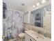 Compact bathroom with white marble-look shower curtain and vanity at 8648 Sw 95Th Ln # A, Ocala, FL 34481