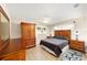 Cozy bedroom with wood accents, natural light, and ceiling fan at 8648 Sw 95Th Ln # A, Ocala, FL 34481