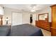 Well-lit bedroom features wood-look floors and double door closet at 8648 Sw 95Th Ln # A, Ocala, FL 34481