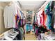 Spacious walk-in closet with custom shelving and ample storage space for clothes and shoes at 8648 Sw 95Th Ln # A, Ocala, FL 34481