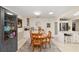 Dining room features adjacent kitchen area with stainless fridge at 8648 Sw 95Th Ln # A, Ocala, FL 34481