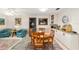 Bright dining area with view to seating area and built-in bar at 8648 Sw 95Th Ln # A, Ocala, FL 34481
