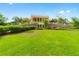 Beautiful building with stone wall, lush landscaping, and manicured lawn in a desirable neighborhood at 8648 Sw 95Th Ln # A, Ocala, FL 34481