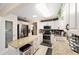 Modern kitchen with stainless appliances, island seating, and ample counter space at 8648 Sw 95Th Ln # A, Ocala, FL 34481