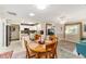Cozy living room and kitchen area with tile floors, dining table, and stainless steel appliances at 8648 Sw 95Th Ln # A, Ocala, FL 34481