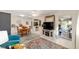 Wide angle of open living area with kitchen, dining room, and office space access at 8648 Sw 95Th Ln # A, Ocala, FL 34481