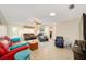 Open living room featuring wood-look flooring, a ceiling fan, and a variety of cozy seating at 8648 Sw 95Th Ln # A, Ocala, FL 34481