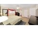 Serene main bedroom with natural light, wood-look flooring, and neutral decor at 8648 Sw 95Th Ln # A, Ocala, FL 34481