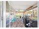 Screened patio featuring outdoor furniture and grill, perfect for entertaining at 8648 Sw 95Th Ln # A, Ocala, FL 34481