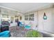 Inviting screened patio with outdoor furniture, grill, and views of the surrounding neighborhood at 8648 Sw 95Th Ln # A, Ocala, FL 34481