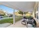 Inviting covered porch with comfortable seating, offering a cozy outdoor living space at 8648 Sw 95Th Ln # A, Ocala, FL 34481