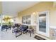 Inviting covered porch with comfortable seating, perfect for relaxing and greeting guests at 8648 Sw 95Th Ln # A, Ocala, FL 34481