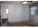 Spacious bedroom with light-blue walls and ceiling fan at 8667 Sw 108Th Pl, Ocala, FL 34481