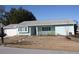 A light blue house with a gray roof, attached garage, and a walkway at 8667 Sw 108Th Pl, Ocala, FL 34481