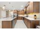 Spacious kitchen featuring wood cabinets and quartz countertops at 8760 Sw 79Th Loop, Ocala, FL 34481