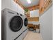 Laundry room with LG washer and dryer, and ample storage at 9475 Sw 71St Loop, Ocala, FL 34481