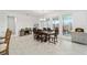 Dining area featuring a wood table and chairs, and lots of natural light at 9874 Sw 106Th Ct, Ocala, FL 34481