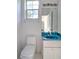 Small bathroom with toilet and vanity at 10043 Sw 202Nd Cir, Dunnellon, FL 34431