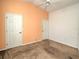 Spacious bedroom with neutral walls and carpet at 10043 Sw 202Nd Cir, Dunnellon, FL 34431