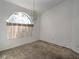 Simple dining room with a large window and chandelier at 10043 Sw 202Nd Cir, Dunnellon, FL 34431