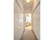 Hallway with built-in closets and bathroom access at 10043 Sw 202Nd Cir, Dunnellon, FL 34431