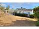 House exterior showing the back of the house, the pool, and the surrounding yard at 10043 Sw 202Nd Cir, Dunnellon, FL 34431