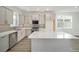 Modern kitchen with stainless steel appliances, granite countertops, and an island at 10322 Sw 99Th Ln, Ocala, FL 34481