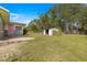 Fenced backyard with shed and patio at 10425 Se 159Th Lane, Summerfield, FL 34491