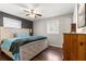 Main bedroom with hardwood floors and ceiling fan at 10425 Se 159Th Lane, Summerfield, FL 34491