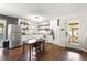 Bright kitchen with white cabinets and wood flooring at 10425 Se 159Th Lane, Summerfield, FL 34491