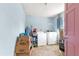 Bright laundry room with washer, dryer, and ample storage at 10425 Se 159Th Lane, Summerfield, FL 34491