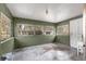 Enclosed porch with multiple windows offering natural light at 10425 Se 159Th Lane, Summerfield, FL 34491