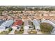 Panoramic aerial view of a well-maintained residential community with manicured lawns and tree-lined streets at 1112 Carvello Dr, The Villages, FL 32162